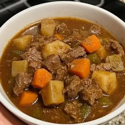 Deliciously flavorful beef stew served in a cozy bowl for a comforting meal.
