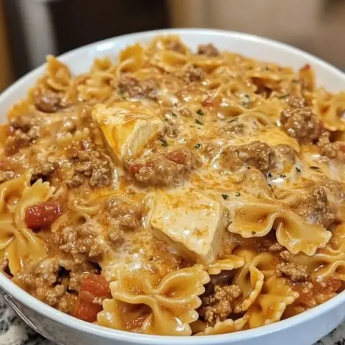 Creamy Velveeta beef bowtie pasta dish served in a bowl
