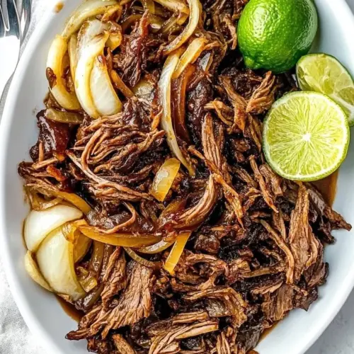 Delicious Cuban crispy shredded beef served with garnish
