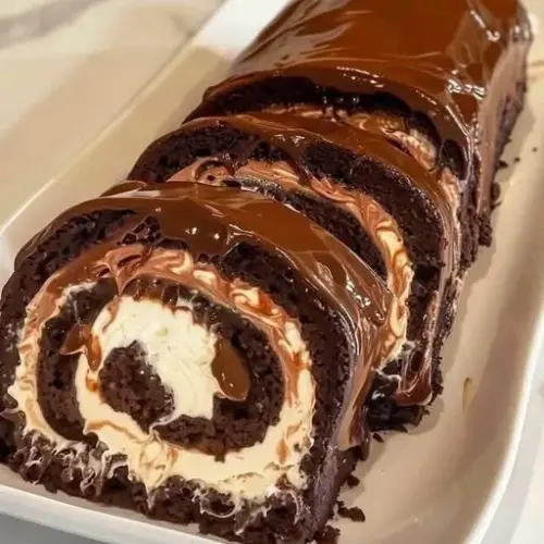 Decadent Chocolate Cake Roll with rich chocolate frosting and cream filling
