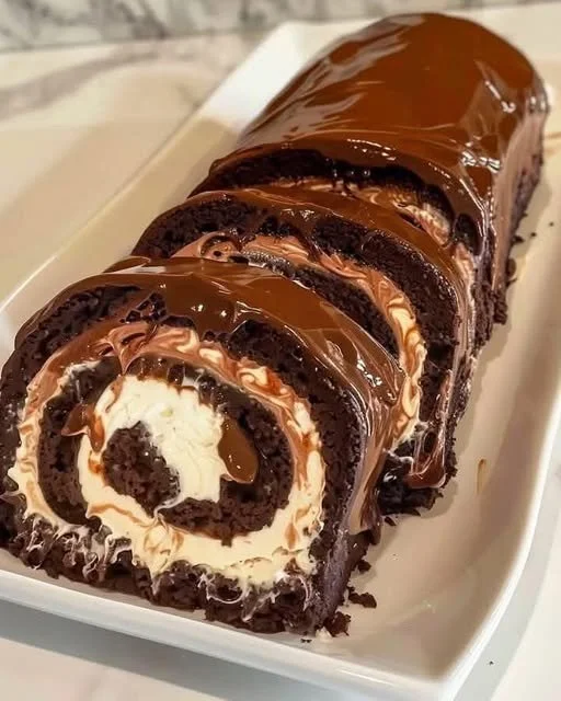 Decadent Chocolate Cake Roll with rich chocolate frosting and cream filling