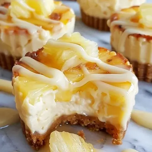 Delicious pineapple cheesecake bites topped with white chocolate.
