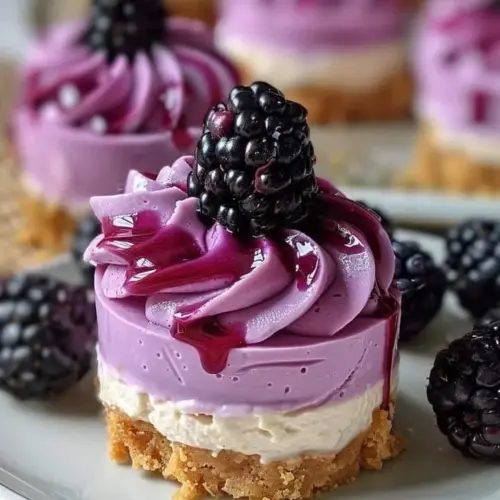 Lavender Blackberry Mini Cheesecake Bites served on a plate
