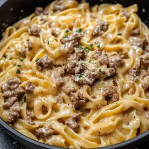 Delicious one pot garlic butter beef pasta served in a bowl with herbs