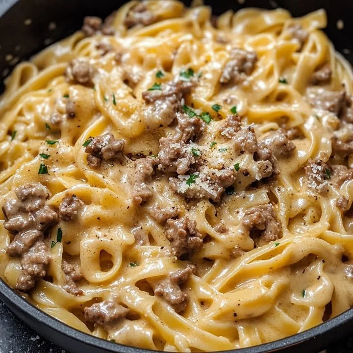 Delicious one pot garlic butter beef pasta served in a bowl with herbs